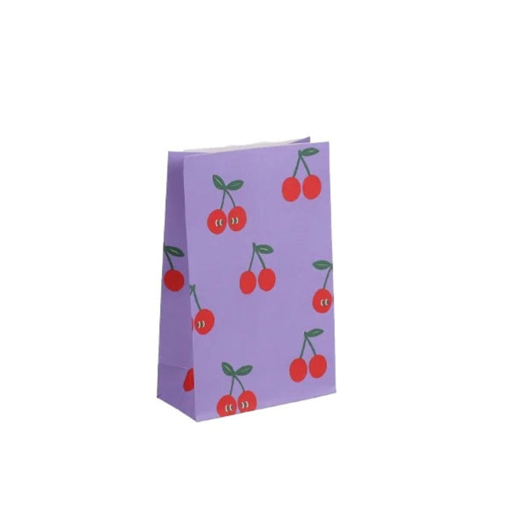 A small lavender paper gift bag with a repeating pattern of red cherries with green stems, shown on a plain white background.