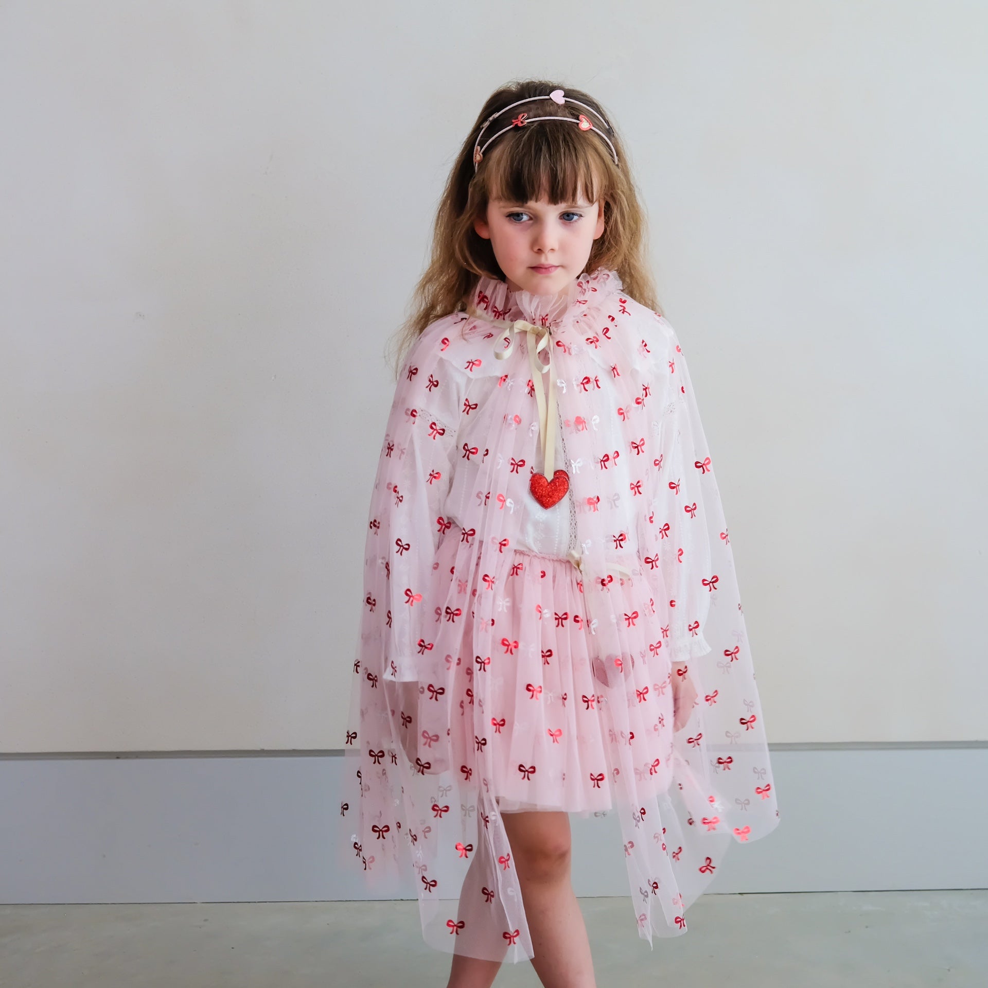 CUTESY BOW PRINT CAPE
