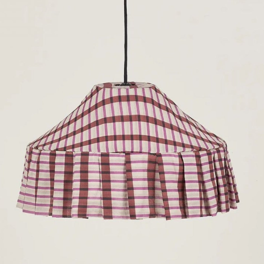 Plaid patterned lampshade on a plain background