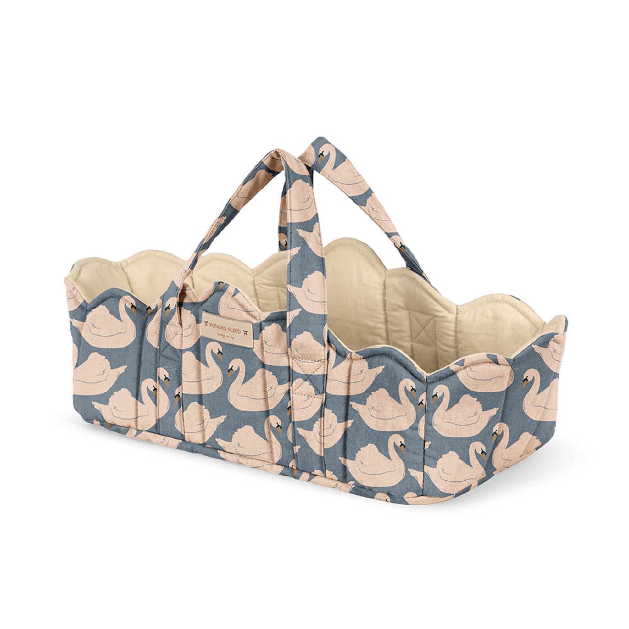 Baby bassinet with swan pattern on a white background
