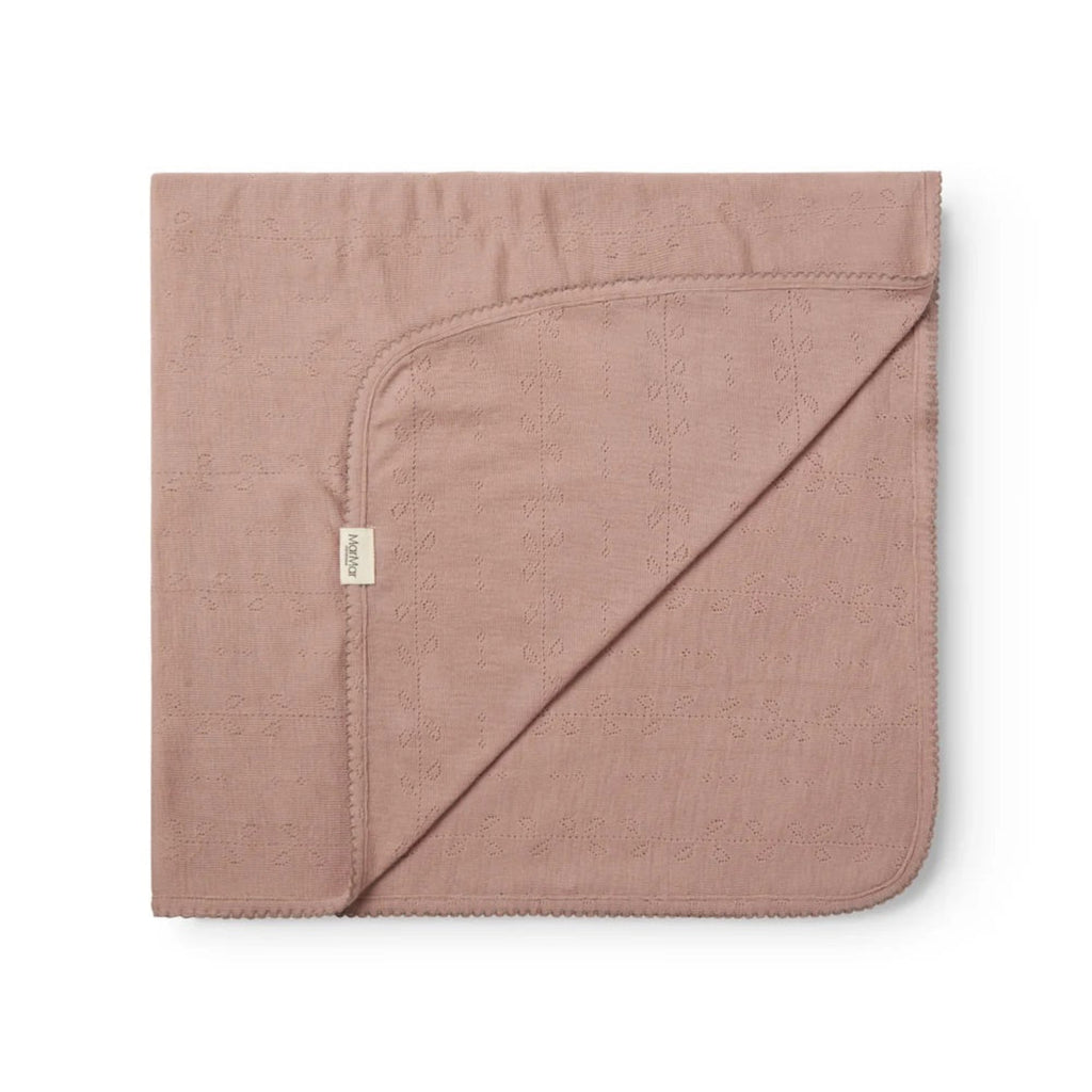 A folded dusty rose pink hooded blanket with a small white tag, displayed on a clean white background.
