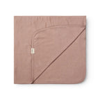 A folded dusty rose pink hooded blanket with a small white tag, displayed on a clean white background.