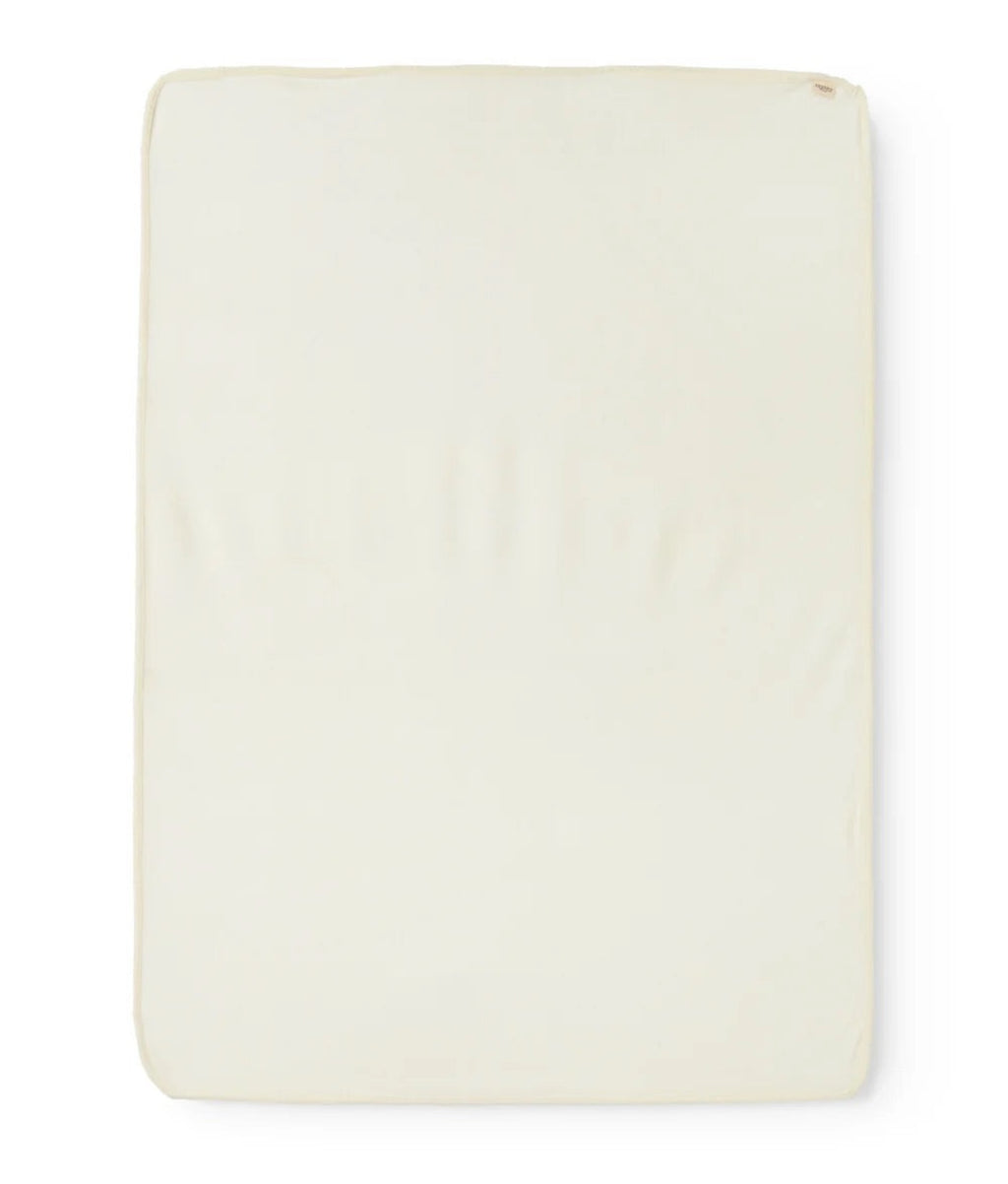 A rectangular cream-colored fabric or foam pad with rounded corners, shown flat against a plain white background.