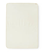 A rectangular cream-colored fabric or foam pad with rounded corners, shown flat against a plain white background.