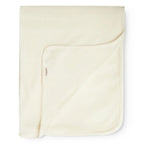 A folded cream-colored cotton blanket with a soft, plush fleece reverse side, shown on a clean white background.