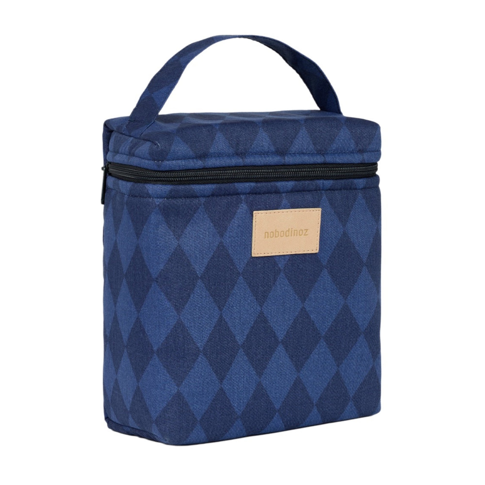 A blue and navy argyle patterned lunch bag with a top carry handle, black zipper, and a tan brand patch on the front, shown on a plain white background.