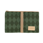 A green argyle patterned pouch with a tan leather strap and a small tan brand label reading 'sebadiaz' on a white background.