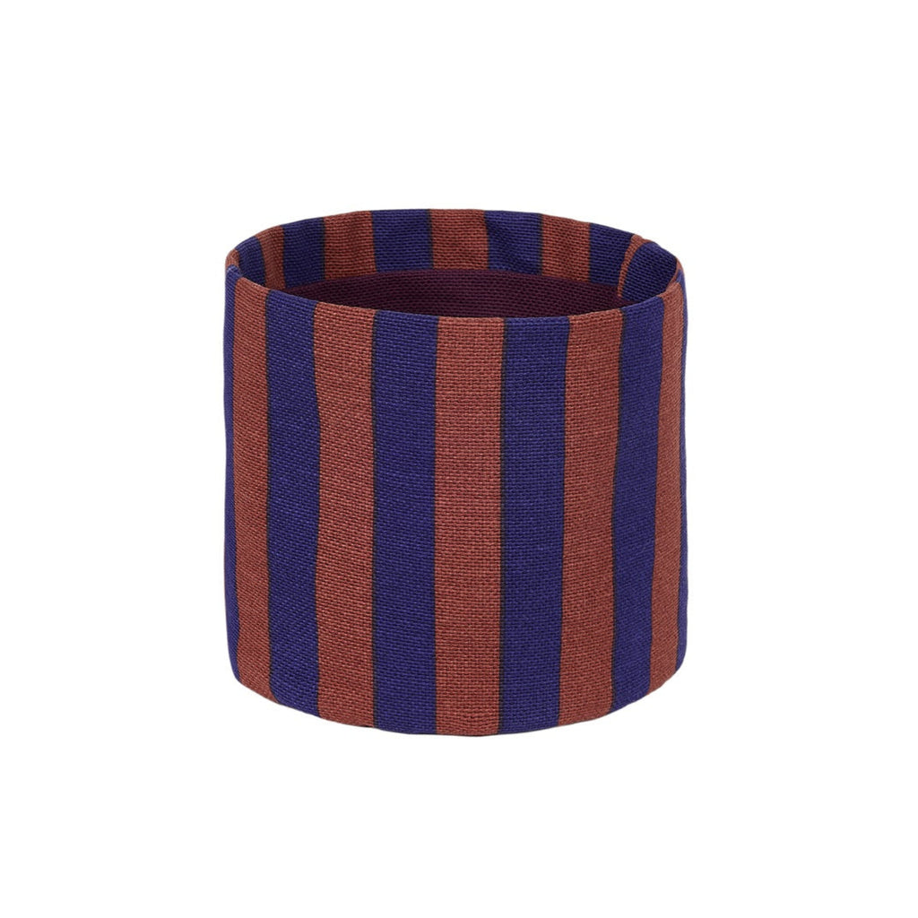 A cylindrical fabric storage basket with vertical stripes in dark blue and rust brown, shown on a plain white background.